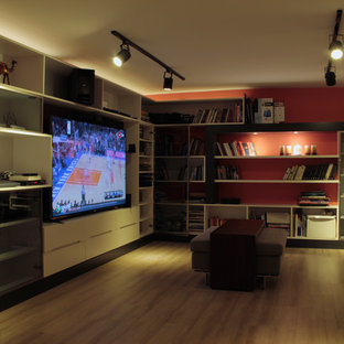 Inspiration for a medium sized contemporary fully buried basement in DC Metro with orange walls, light hardwood flooring, no fireplace and brown floors.