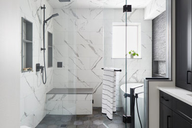 Example of a large minimalist master black and white tile and mosaic tile porcelain tile, white floor, double-sink, tray ceiling and brick wall bathroom design in Toronto with shaker cabinets, black cabinets, a one-piece toilet, white walls, an undermount sink, quartz countertops, a hinged shower door, white countertops, a niche and a built-in vanity