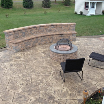 Stamped concrete patios with seating wall and Fire pit