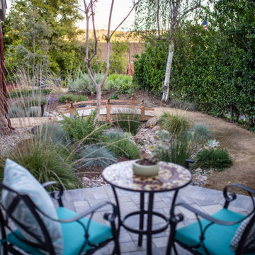 Paver patio, decomposed granite path, wooden bridge