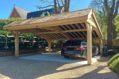 Inspiration for a medium sized traditional detached double garage in Surrey.