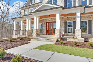 This is an example of a transitional stone porch design in Atlanta.