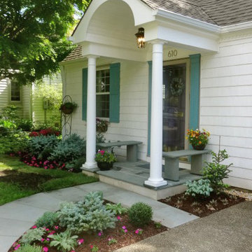 Colonial Style Front Portico with Columns and Blue Stone Sidewalk