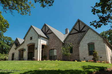 Example of a large mountain style two-story exterior home design in Dallas