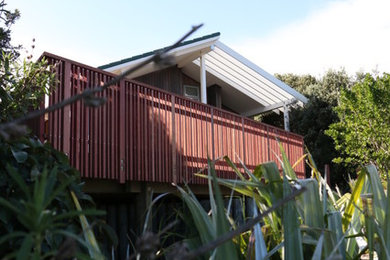 Photo of a mid-sized beach style deck in Wellington.