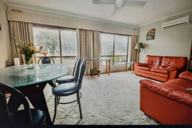 Photo of a modern living room in Other with beige walls, carpet and beige floor.