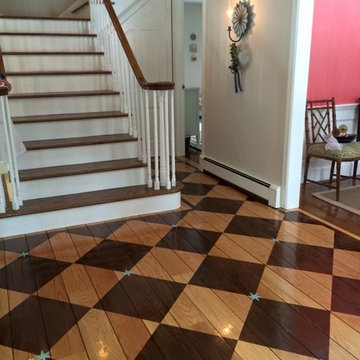 Foyer checkerboard stained floor with hand painted blue accent stars