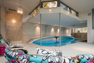 This is an example of a beach style pool in Dusseldorf.