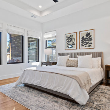 Modern Lakeside Farmhouse Master Bedroom with Tray Ceiling and Natural Light