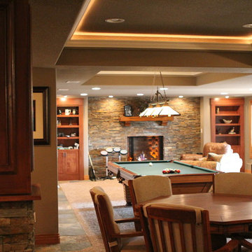 Eye-popping Denver Basement Remodel with hidden bookcase doors and tray ceilings
