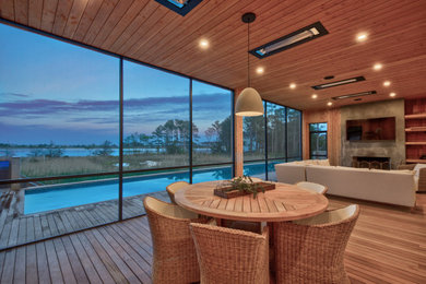 Beach style home design photo in Other