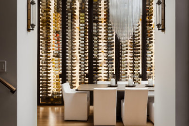 Mid-sized trendy light wood floor wine cellar photo in Chicago