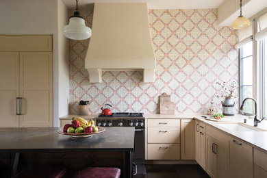 Photo of a country l-shaped kitchen in Austin with an undermount sink, shaker cabinets, beige cabinets, multi-coloured splashback and with island.