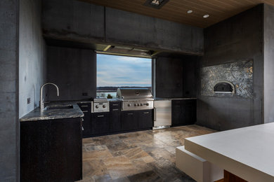Inspiration for a modern backyard stone patio kitchen remodel in Charlotte with a roof extension