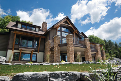 Large craftsman brown two-story mixed siding gable roof idea in New York