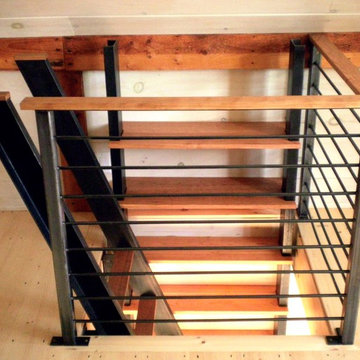Cherry and steel stairs and bookcase