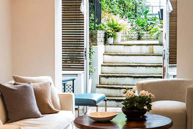 Design ideas for a medium sized contemporary enclosed living room in London with dark hardwood flooring and brown floors.