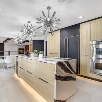 Glamorous gloss cabinetry with luxury Bentley quartz countertops.