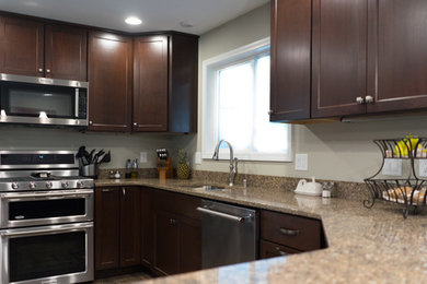 Inspiration for a mid-sized u-shaped ceramic tile enclosed kitchen remodel in Other with an undermount sink, shaker cabinets, dark wood cabinets, quartz countertops, brown backsplash, stainless steel appliances and a peninsula
