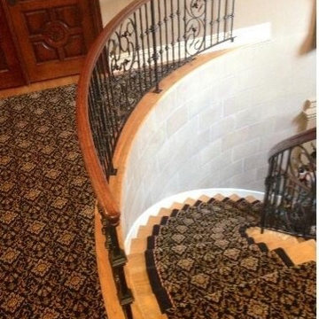 Main spiral staircase with waterfall style runner