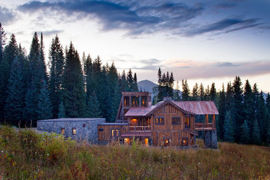 Rustic two-story gable roof idea in Denver