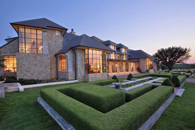 Photo of a huge victorian full sun backyard landscaping in Austin.