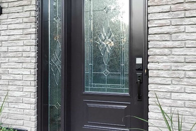 Inspiration for a medium sized modern front door in Toronto with white walls, dark hardwood flooring, a single front door, a brown front door and beige floors.