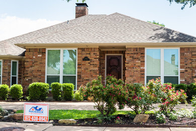 Inspiration for a mid-sized transitional brown one-story brick house exterior remodel in Dallas with a hip roof and a shingle roof