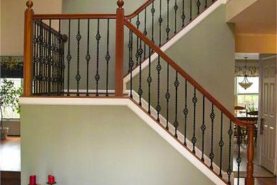 Mid-sized traditional wood u-shaped staircase in Baltimore with wood risers and wood railing.
