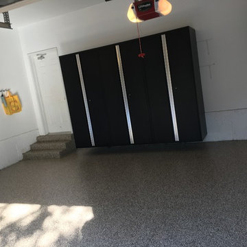 Oakville garage floor with our new mtal cabinets