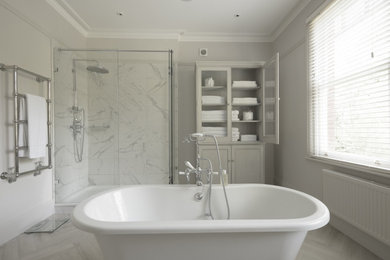 Inspiration for a contemporary grey and white bathroom in Kent with a claw-foot bath, a walk-in shower, grey tiles, porcelain tiles, a built-in sink, quartz worktops, a hinged door, grey worktops and double sinks.