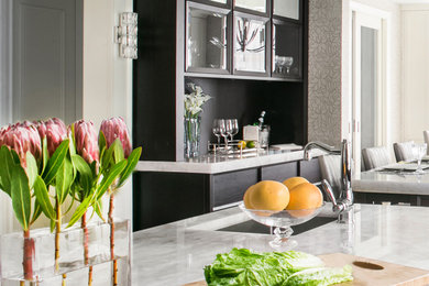 Huge transitional u-shaped porcelain tile eat-in kitchen photo in New York with an undermount sink, recessed-panel cabinets, white cabinets, quartzite countertops, metallic backsplash, metal backsplash, stainless steel appliances and two islands