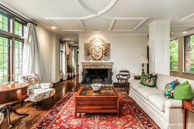 Inspiration for a large timeless formal and enclosed dark wood floor and brown floor living room remodel in Kansas City with white walls, a standard fireplace, a stone fireplace and no tv