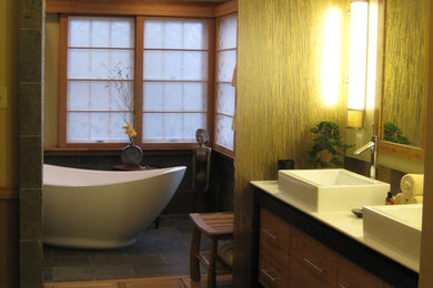Example of a mid-sized zen master stone tile ceramic tile bathroom design in DC Metro with flat-panel cabinets, medium tone wood cabinets, beige walls, a vessel sink and quartzite countertops