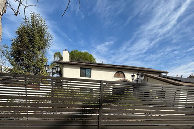 Large modern beige house exterior idea in Los Angeles