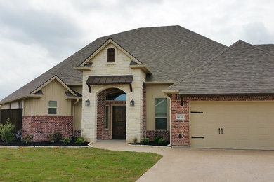 Example of an arts and crafts one-story exterior home design in Austin