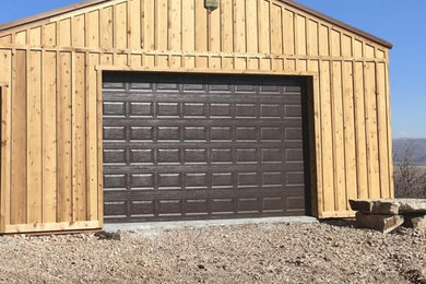 Inspiration for a mid-sized rustic detached one-car boathouse remodel in Other