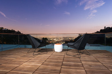 Example of a large minimalist rooftop deck design in Los Angeles with no cover