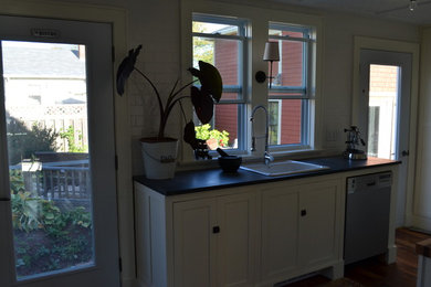 Eat-in kitchen - eat-in kitchen idea in Other with soapstone countertops