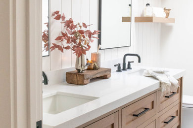 Bathroom - farmhouse double-sink bathroom idea in San Francisco with light wood cabinets and quartz countertops