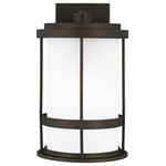 Sea Gull Lighting - Sea Gull Wilburn Medium 1-LT Outdoor Wall, Bronze/White/Satin - With a nod to retro-industrial chic, the Wilburn outdoor fixtures wraps a white frosted glass shade in a fun metal cage to create a casual and easygoing look. Offered in Antique Bronze and Black finishes with Etched White glass, the assortment includes a one-light outdoor pendant, small medium, large, and extra-large one-light outdoor wall lanterns, a one-light out door post lantern and a one-light outdoor ceiling flush mount. Both incandescent lamping and ENERGY STAR-qualified LED lamping are available for most of the fixtures, and some can easily convert to LED by purchasing LED replacement lamps sold separately.