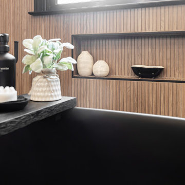 Modern Luxury Master Bathroom with Black Solid Surface Tub