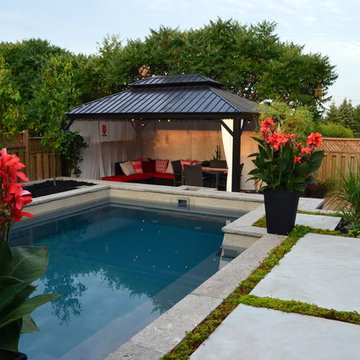Modern Landscape with Fiberglass Pool, slab patio, water feature and more!