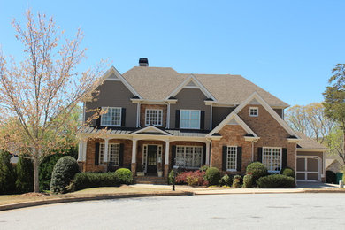 Large traditional multicolored two-story mixed siding house exterior idea in Atlanta with a hip roof and a shingle roof