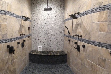 Bathroom - large transitional master beige tile and stone tile travertine floor and beige floor bathroom idea in Orange County with raised-panel cabinets, dark wood cabinets, beige walls, an undermount sink and marble countertops