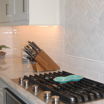Herringbone backsplash in light grey