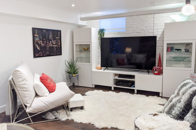 Family room - mid-sized contemporary open concept vinyl floor and brown floor family room idea in Toronto with white walls, a tv stand, a standard fireplace and a brick fireplace