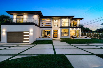 Huge contemporary white two-story exterior home idea in Los Angeles