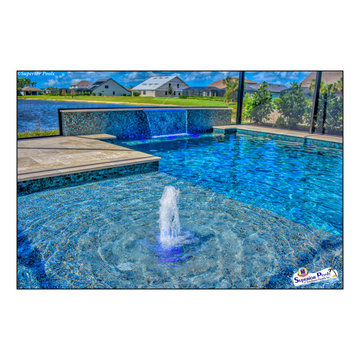 (Rennehan) FT MYERS FL Superior Pools Swimming Pool With Raised Wall & Waterfall