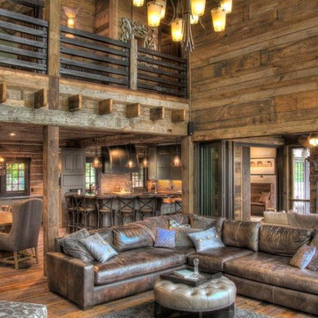 Weathered Antique Flooring, Paneling, and Timbers in a Two Story Great Room